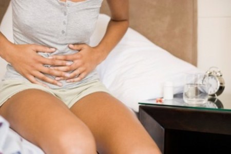 Боль в животе как симптом ПМС и беременности